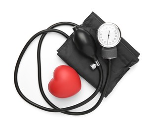 Blood pressure measuring device and red decorative heart isolated on white, top view