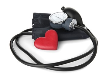 Photo of Blood pressure measuring device and red decorative heart isolated on white