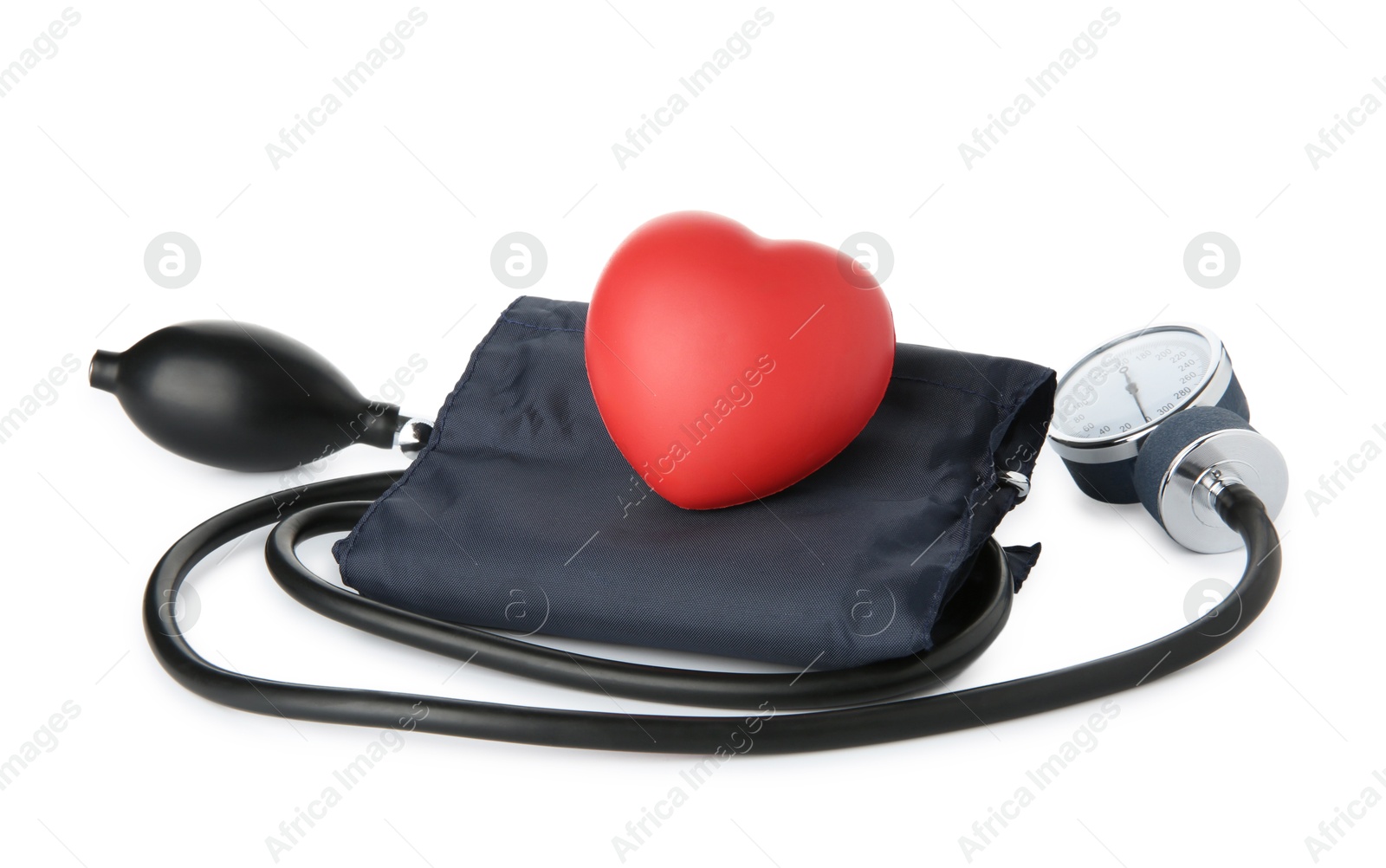 Photo of Blood pressure measuring device and red decorative heart isolated on white