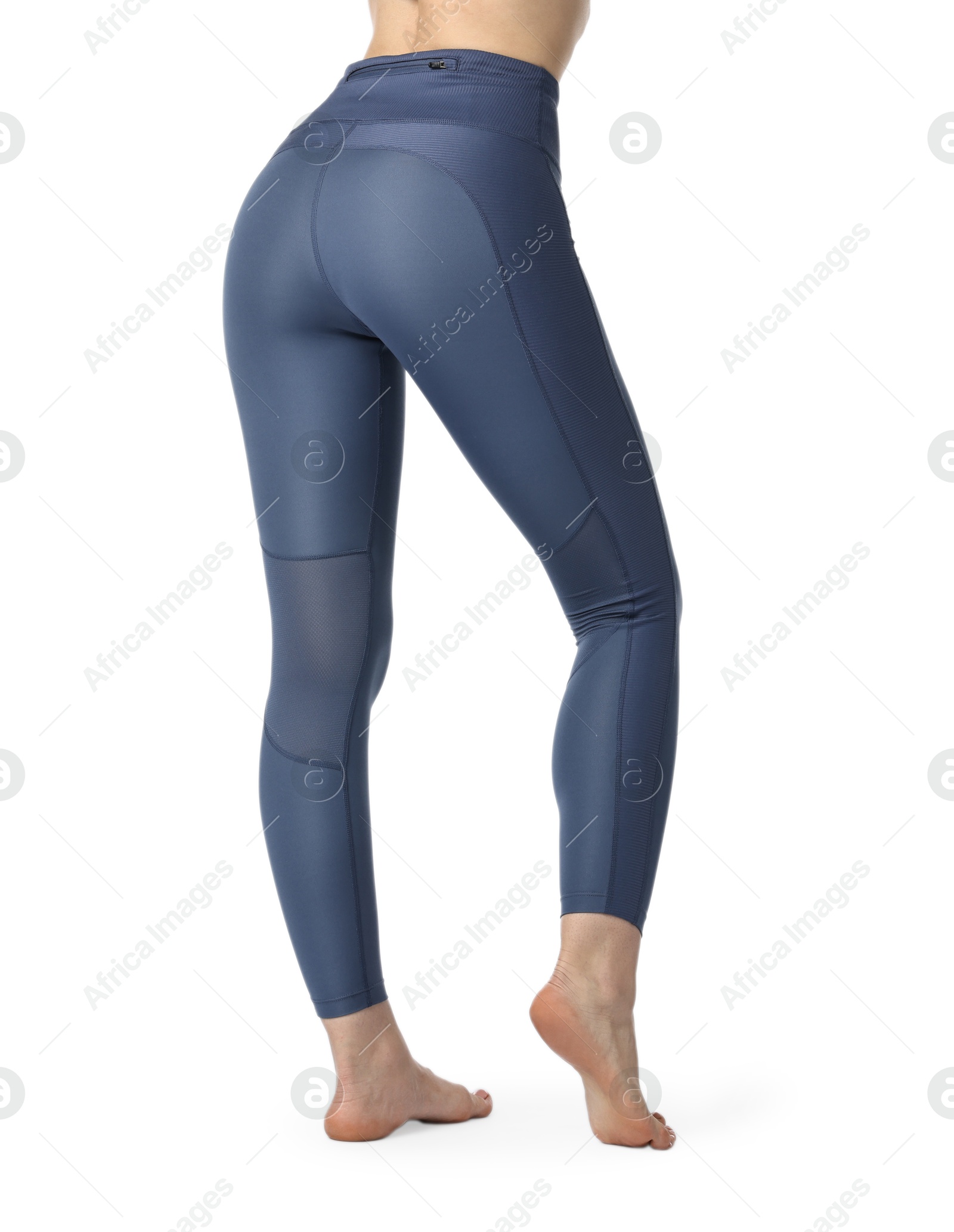 Photo of Woman wearing sports leggings on white background, closeup