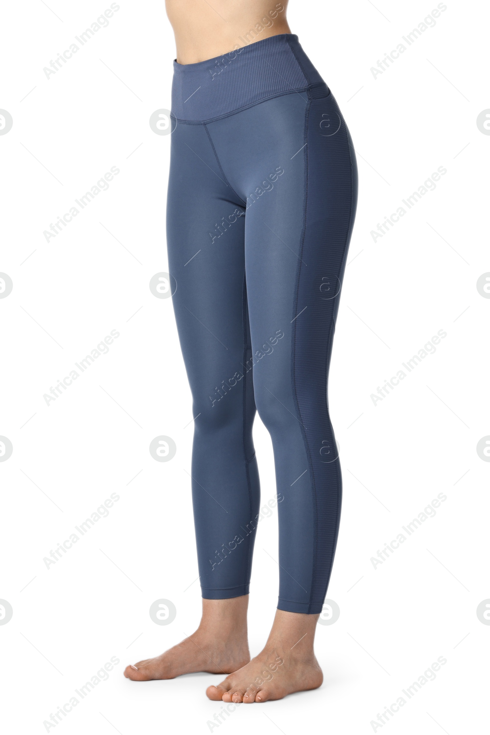 Photo of Woman wearing sports leggings on white background, closeup