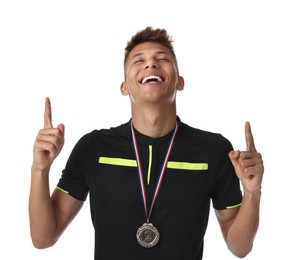 Happy winner with silver medal pointing upwards on white background