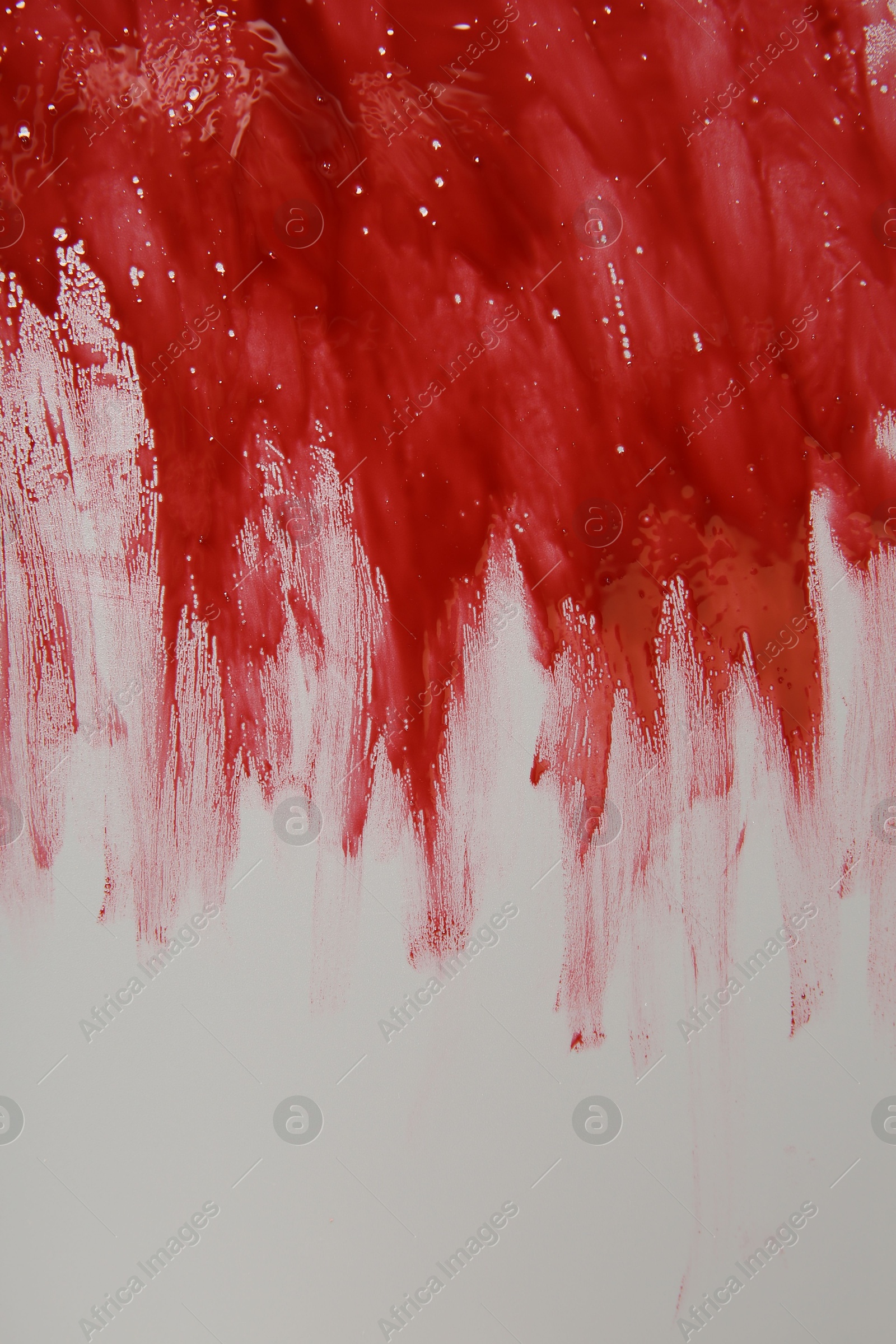 Photo of Red blood on light grey background, top view