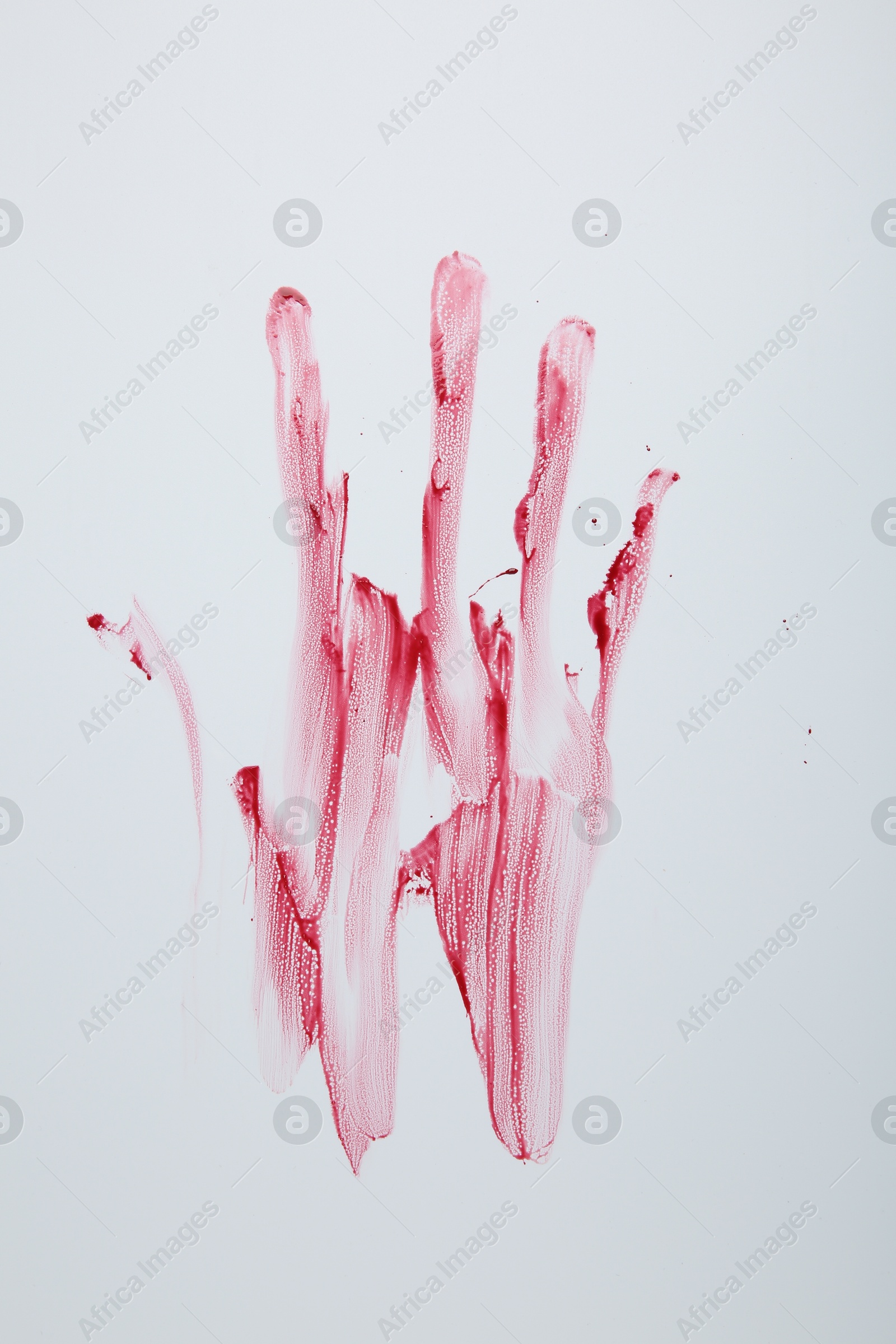 Photo of Bloody handprint on light background, top view