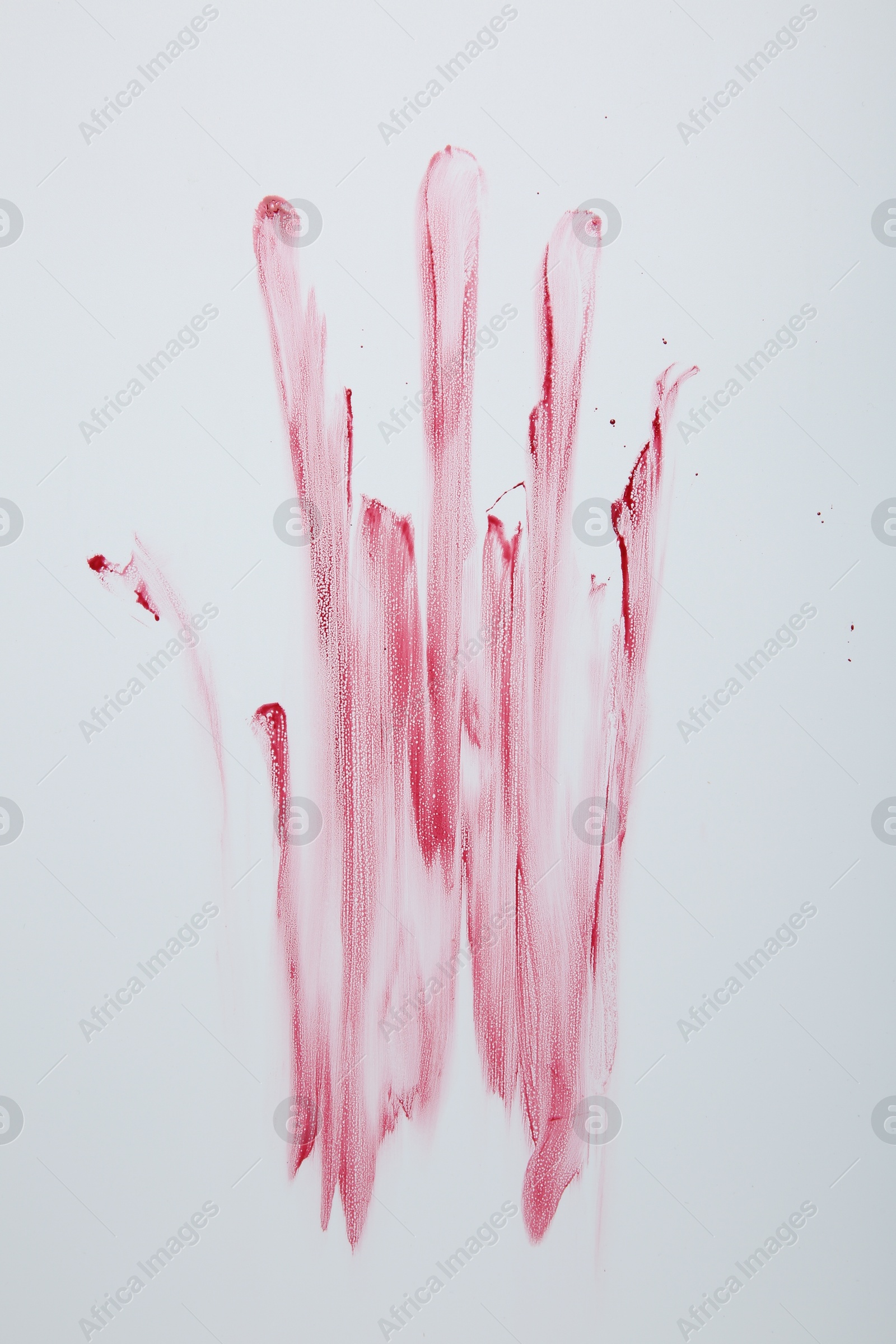 Photo of Bloody handprint on light background, top view