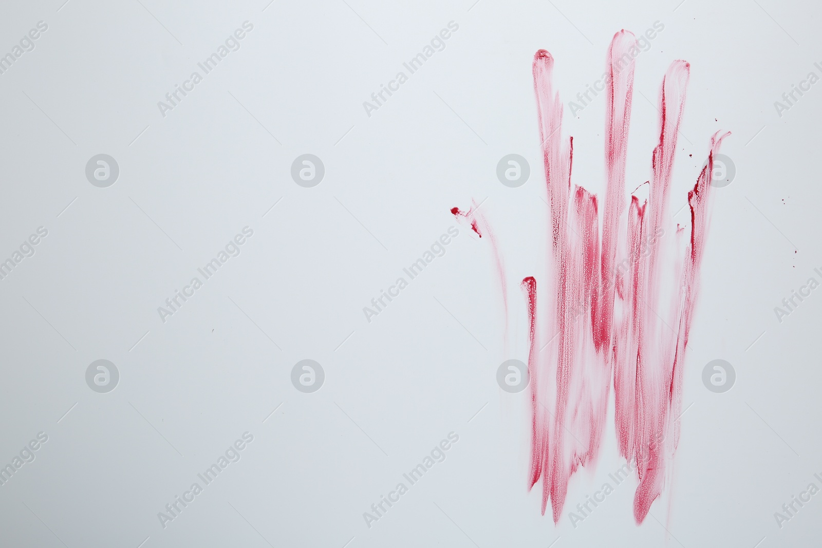 Photo of Bloody handprint on light background, top view. Space for text