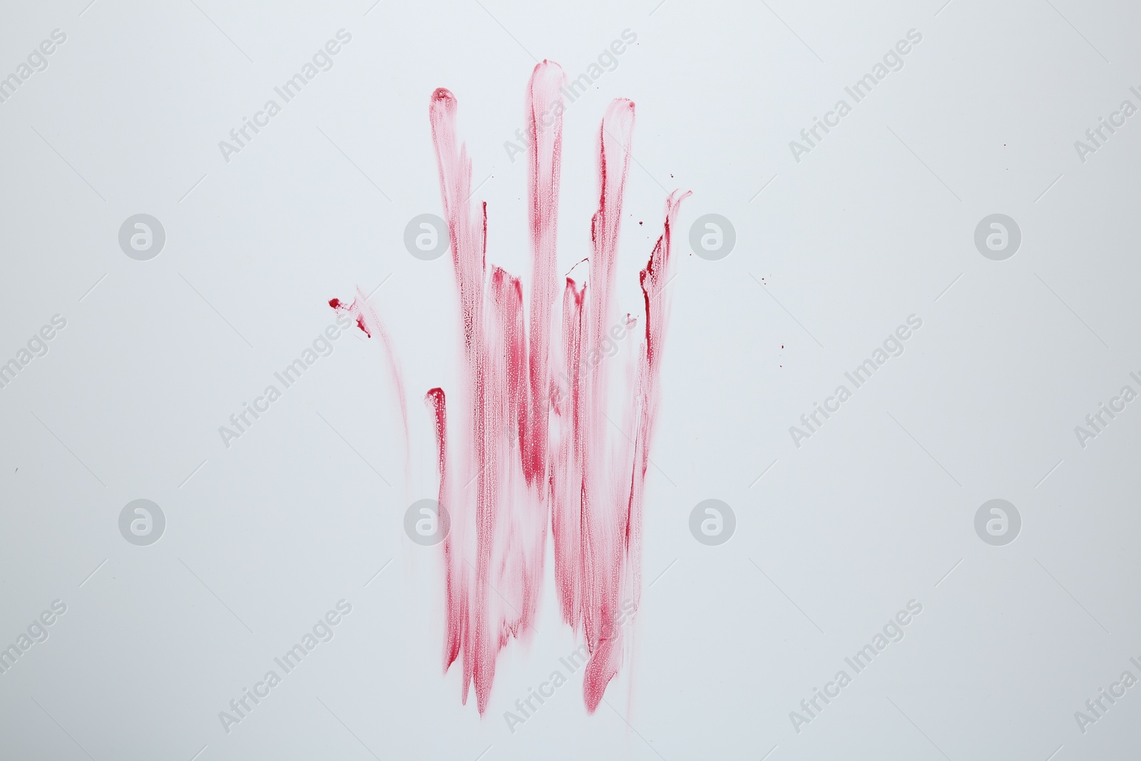 Photo of Bloody handprint on light background, top view