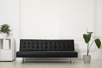 Photo of Comfortable couch in living room. Interior design