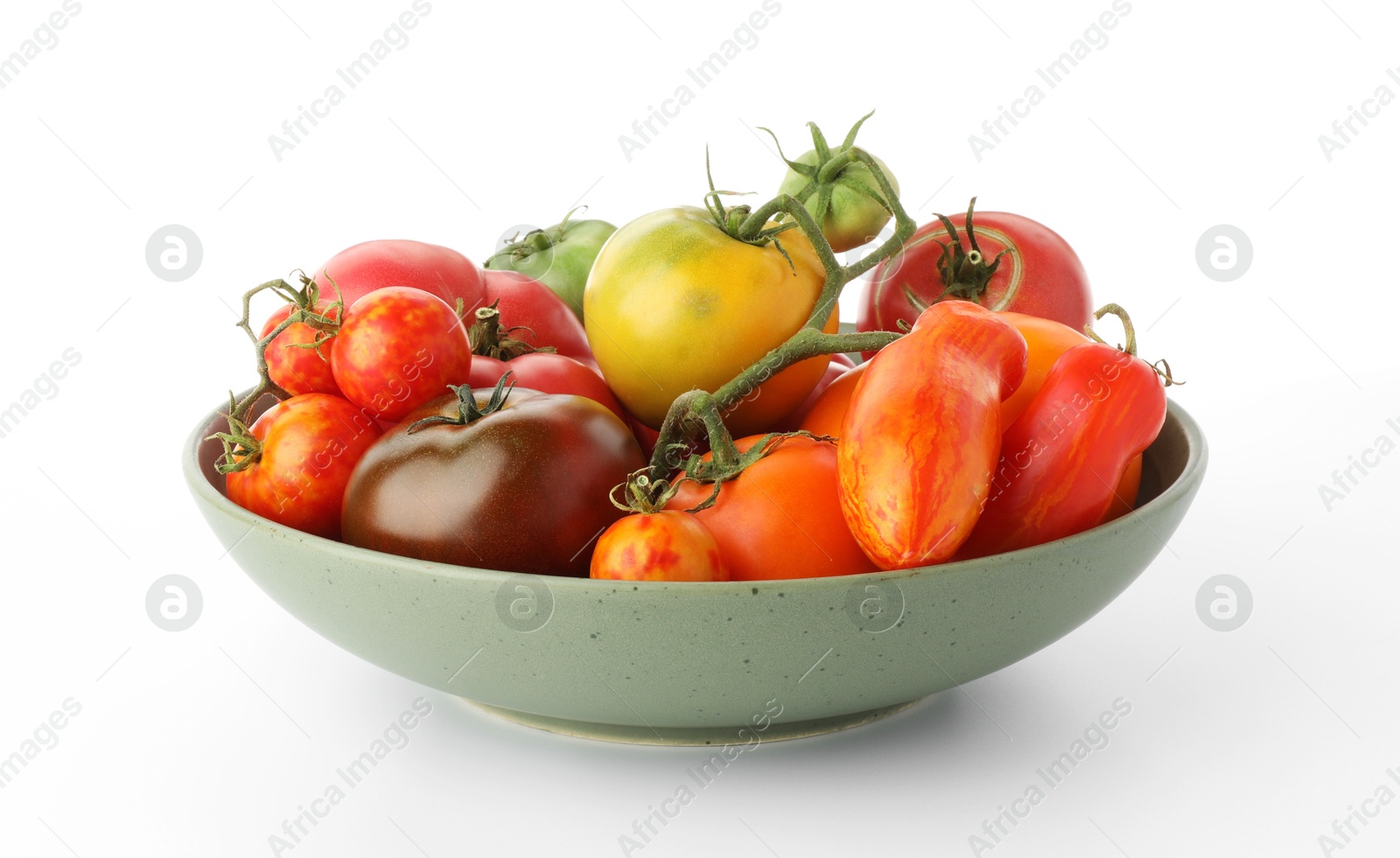 Photo of Different ripe tomatoes in bowl on white background