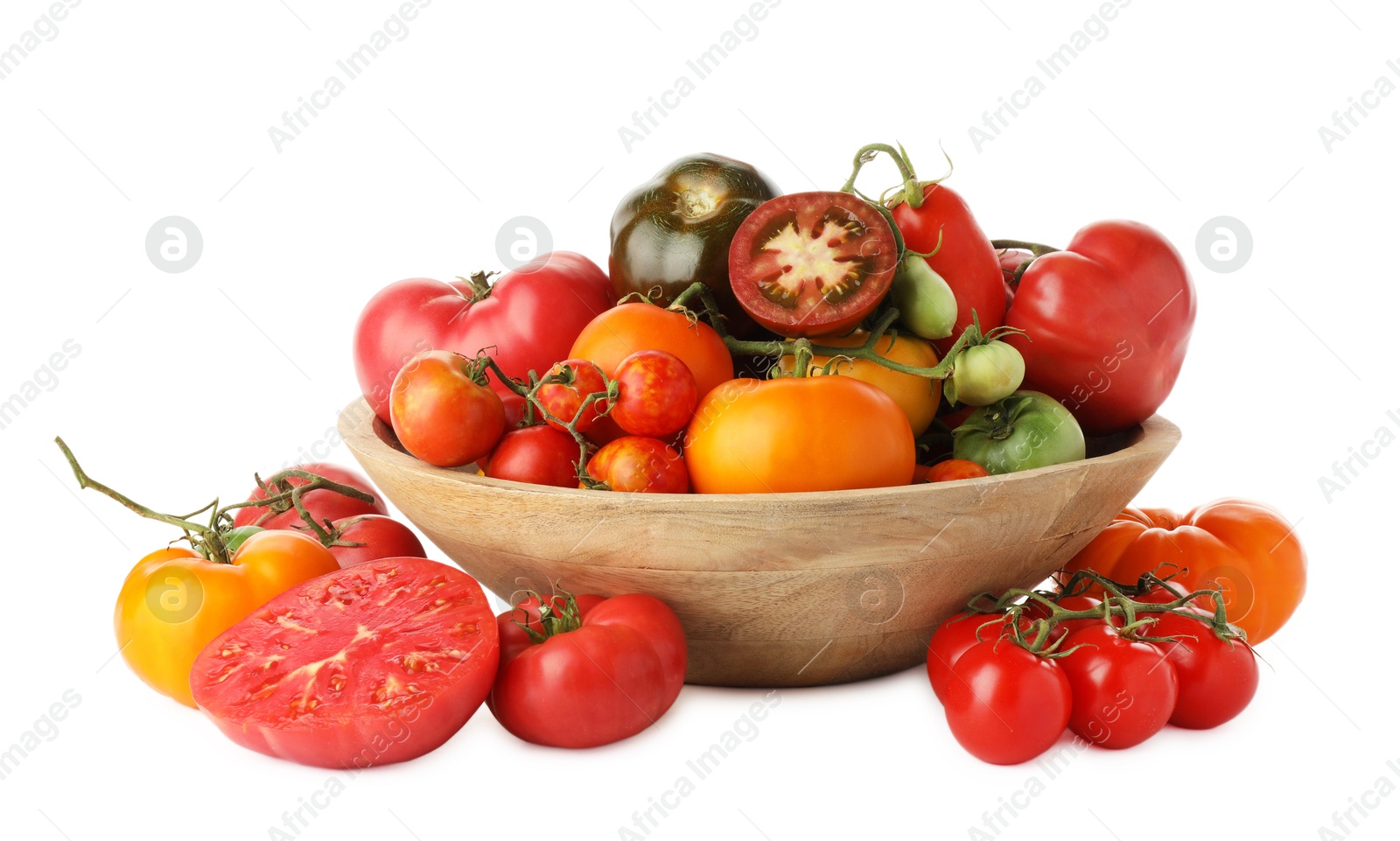 Photo of Different ripe tomatoes in bowl isolated on white