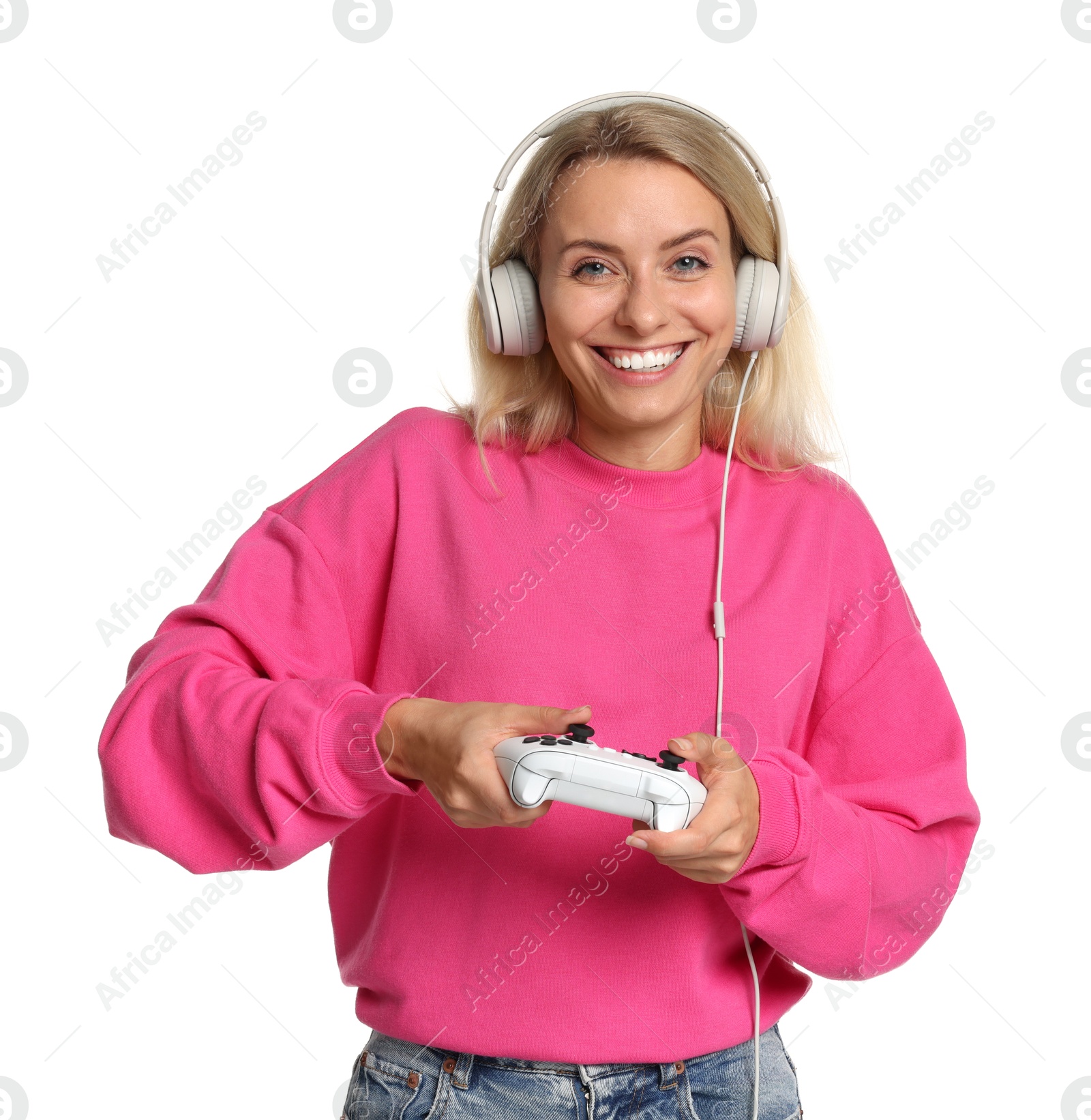 Photo of Happy woman in headphones playing video games with controller on white background