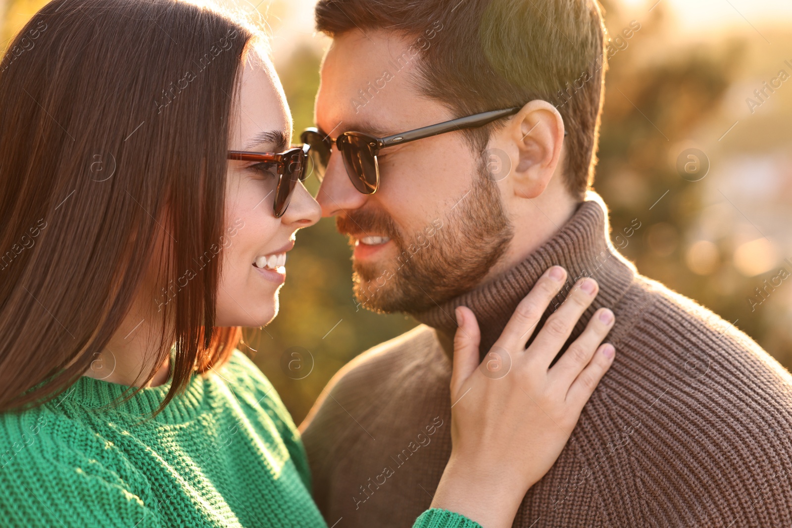 Photo of Beautiful couple enjoying their time together outdoors in autumn evening