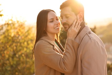 Photo of Beautiful couple enjoying their time together outdoors in autumn evening