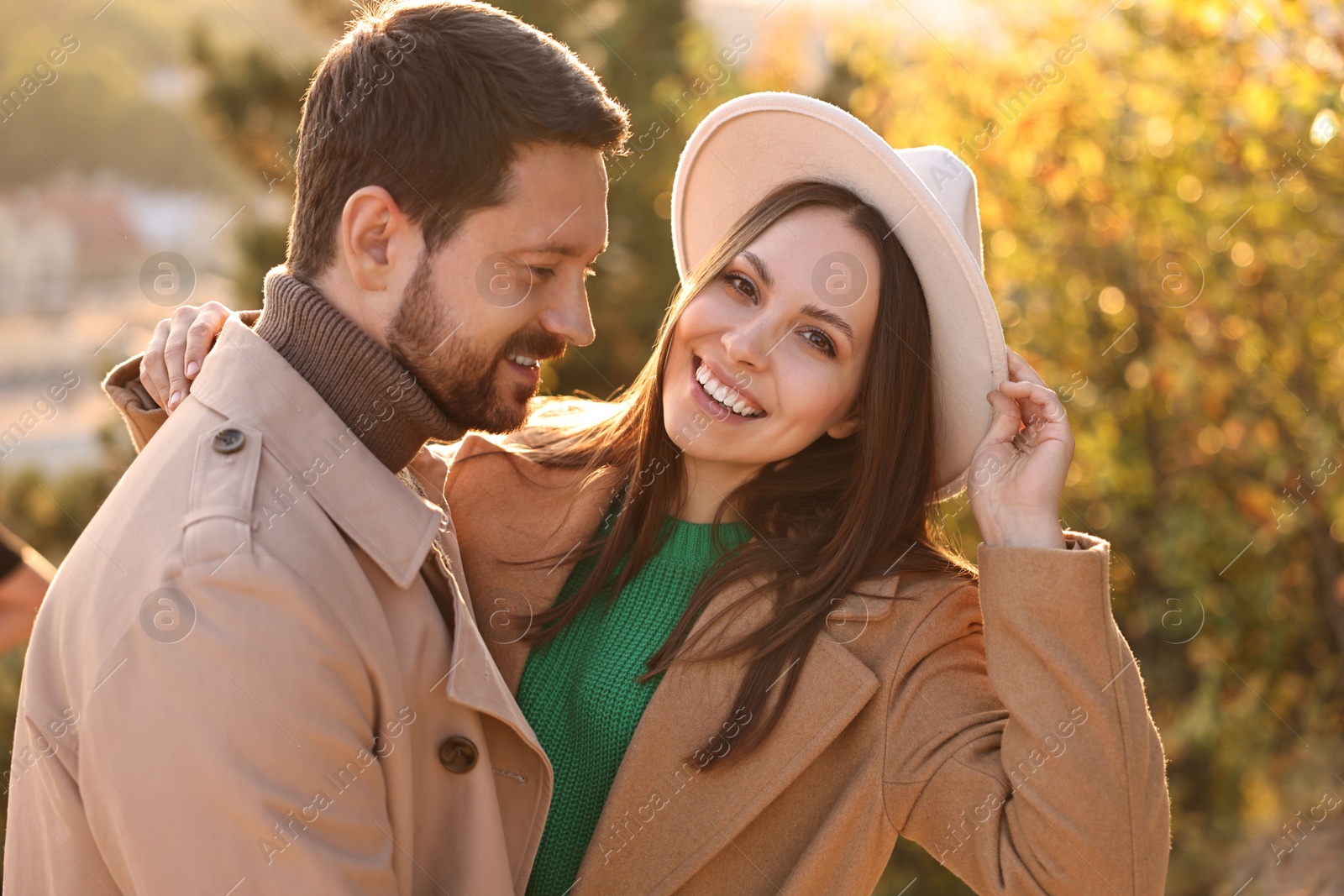 Photo of Beautiful couple spending time together in autumn park