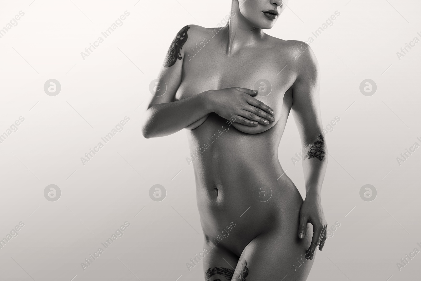 Image of Beautiful nude woman posing on white background, closeup. Black and white effect