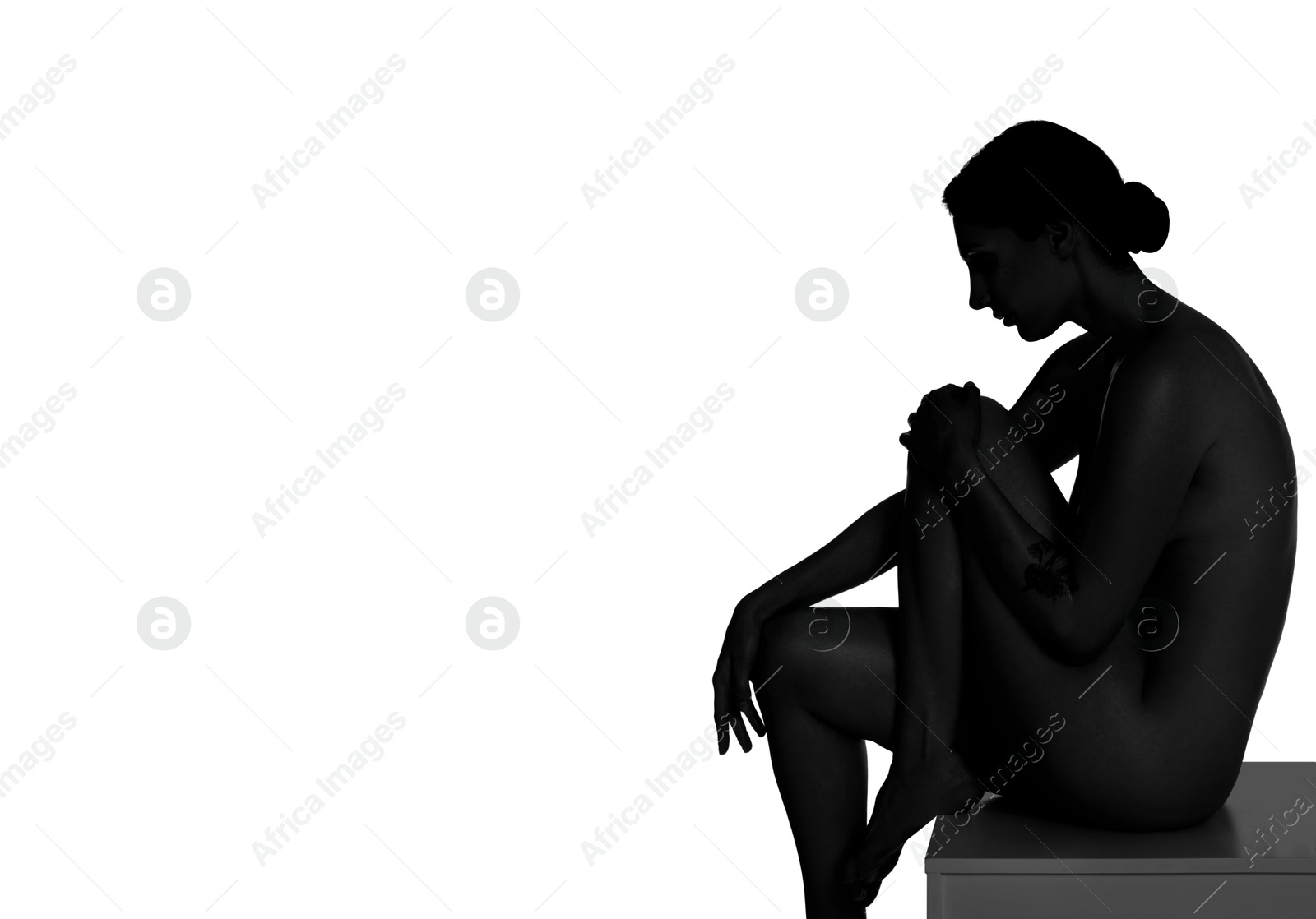 Image of Beautiful nude woman posing on white background. Black and white effect