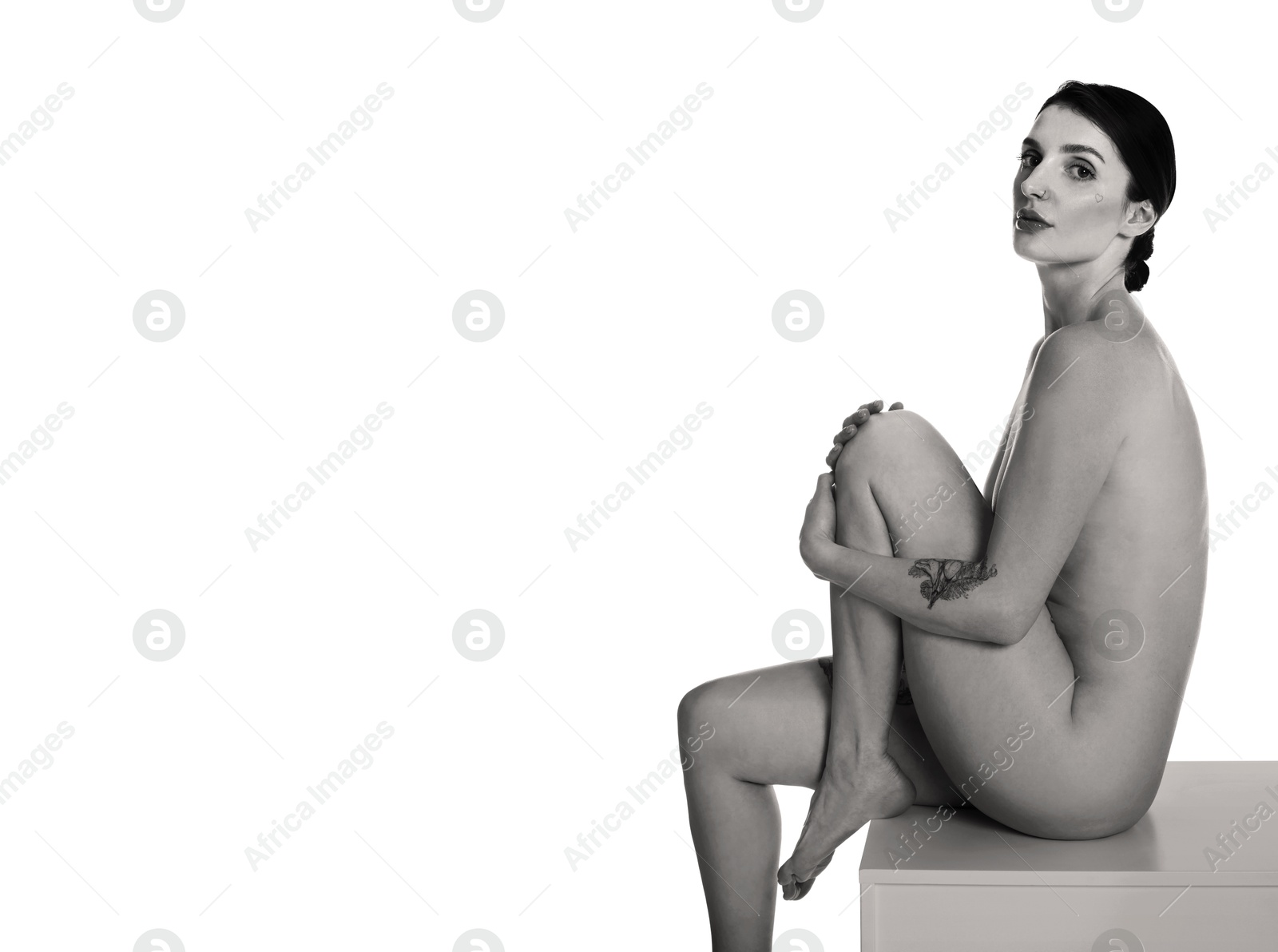 Image of Beautiful nude woman posing on white background. Black and white effect