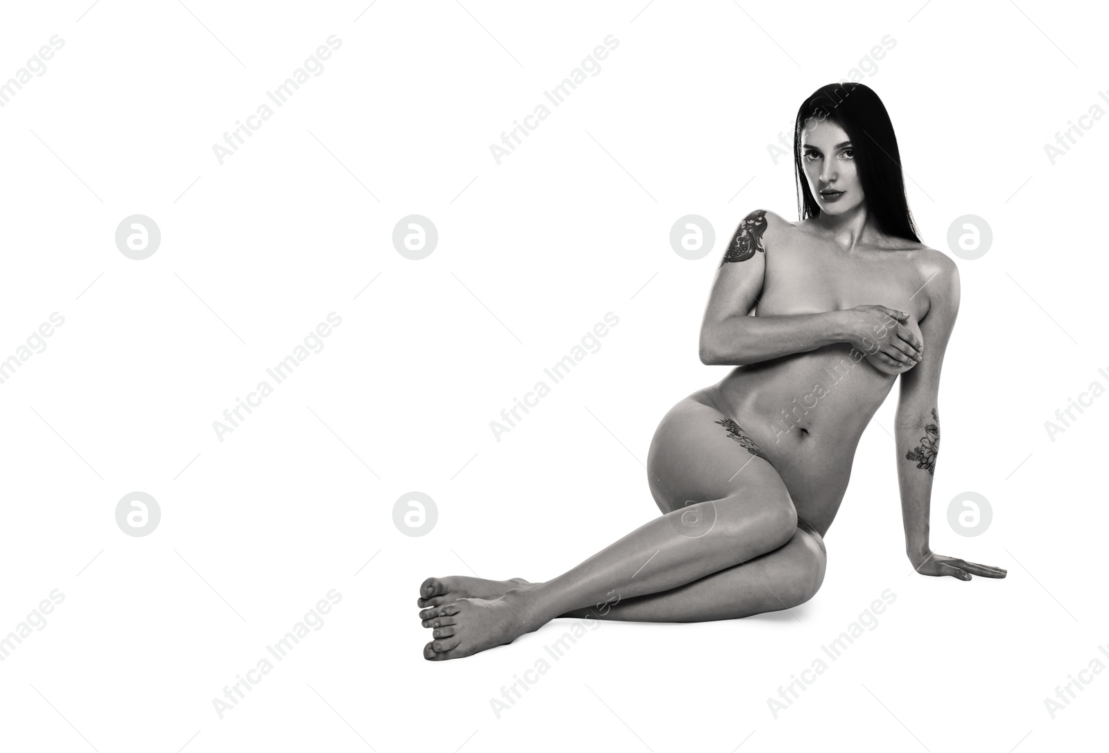 Image of Beautiful nude woman posing on white background. Black and white effect