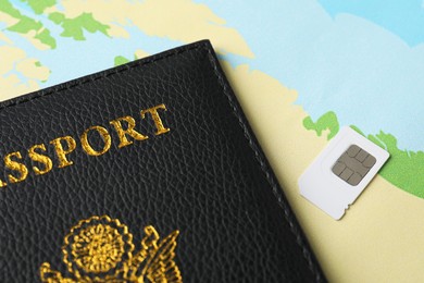 Photo of Passport and Sim card on world map