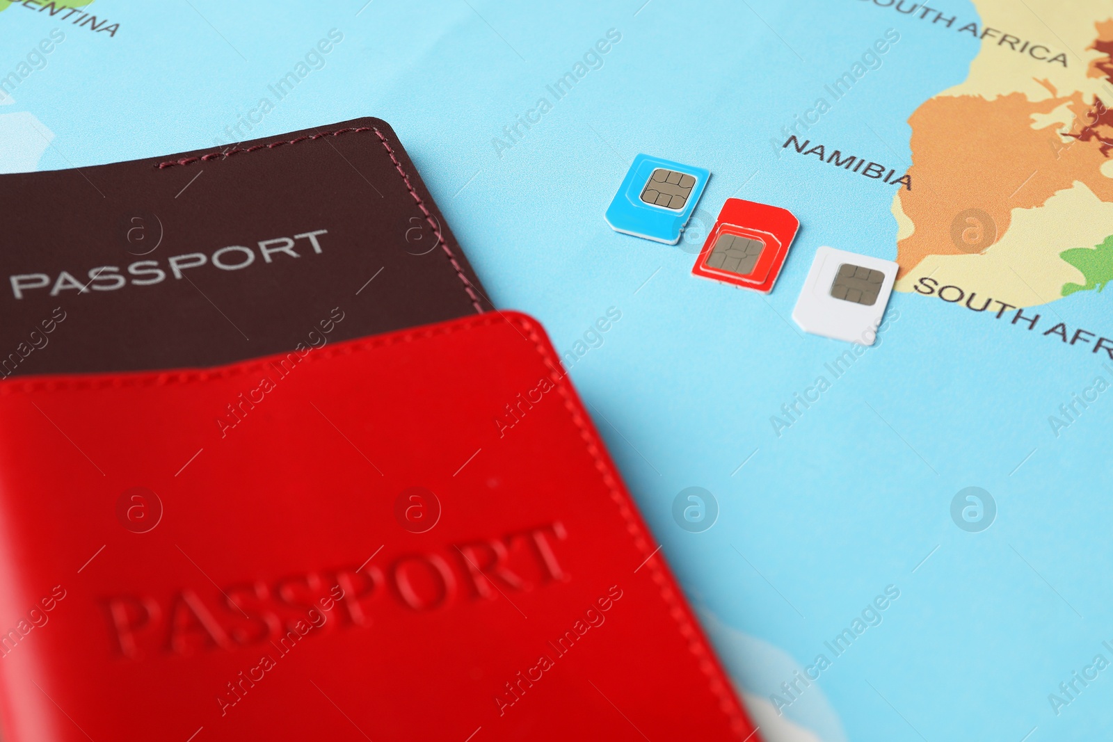 Photo of Passports and SIM cards on world map