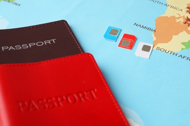 Photo of Passports and SIM cards on world map