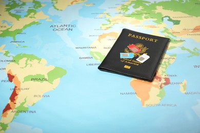 Photo of Modern SIM cards and passport on world map