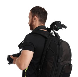 Photographer with backpack, tripod and camera on white background