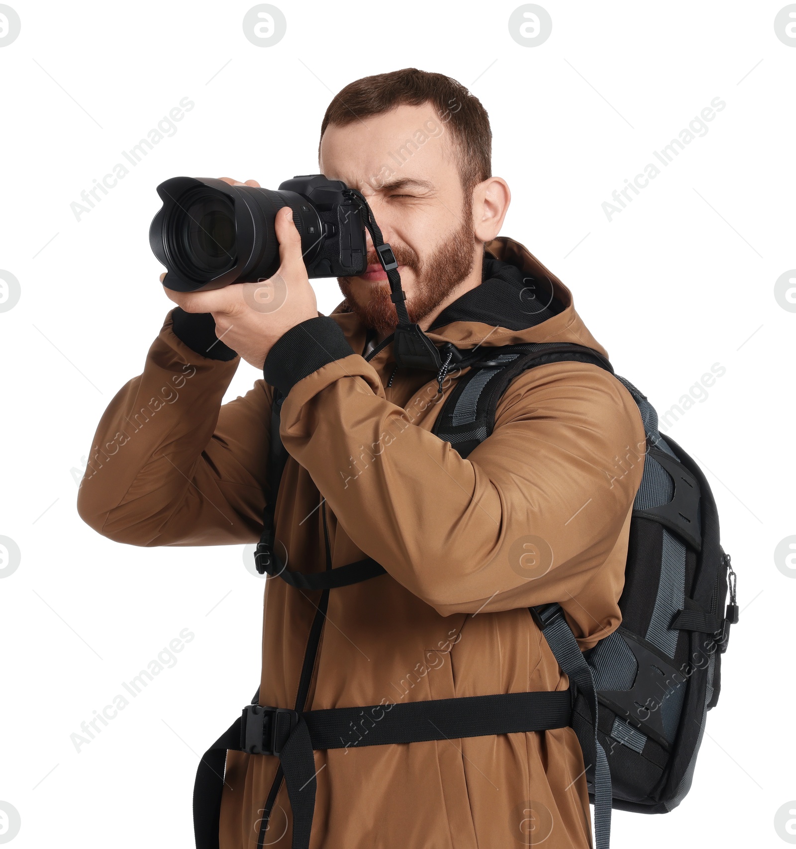 Photo of Photographer with backpack and camera taking picture on white background