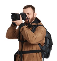 Photographer with backpack and camera taking picture on white background