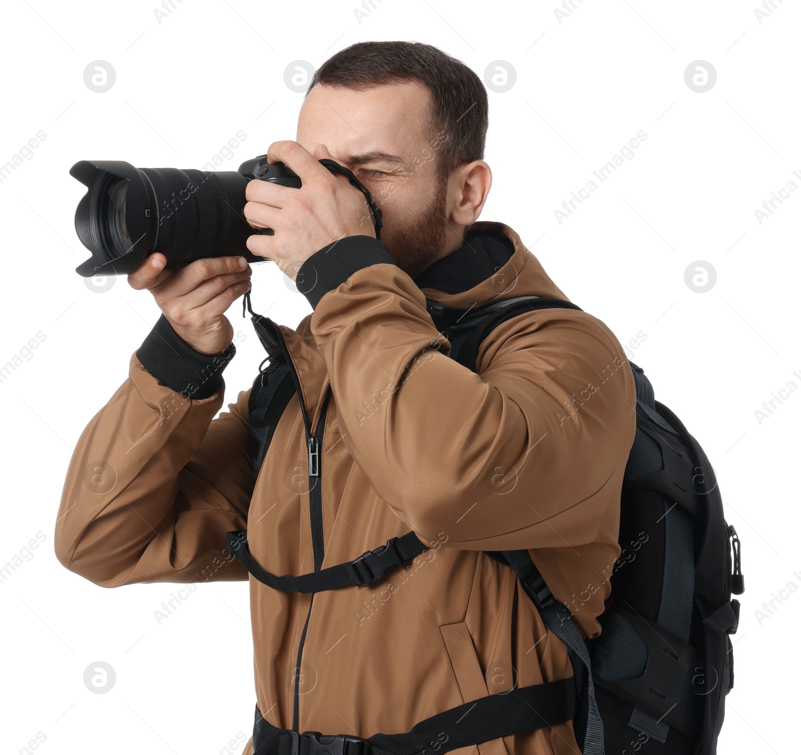 Photo of Photographer with backpack and camera taking picture on white background