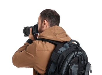 Photographer with backpack and camera taking picture on white background, back view