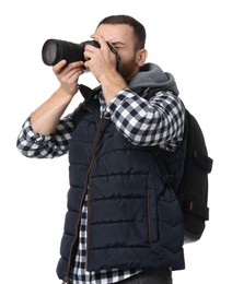 Photo of Photographer with backpack and camera taking picture on white background