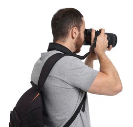 Photo of Photographer with backpack and camera taking picture on white background