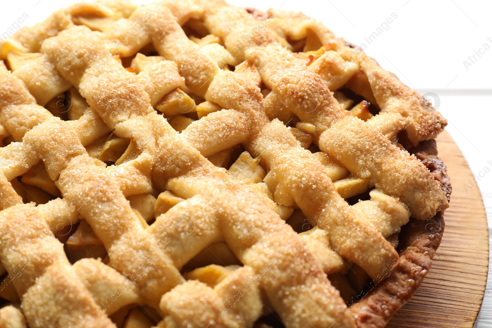 Photo of Tasty homemade apple pie on white table, closeup