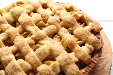 Photo of Tasty homemade apple pie on white table, closeup