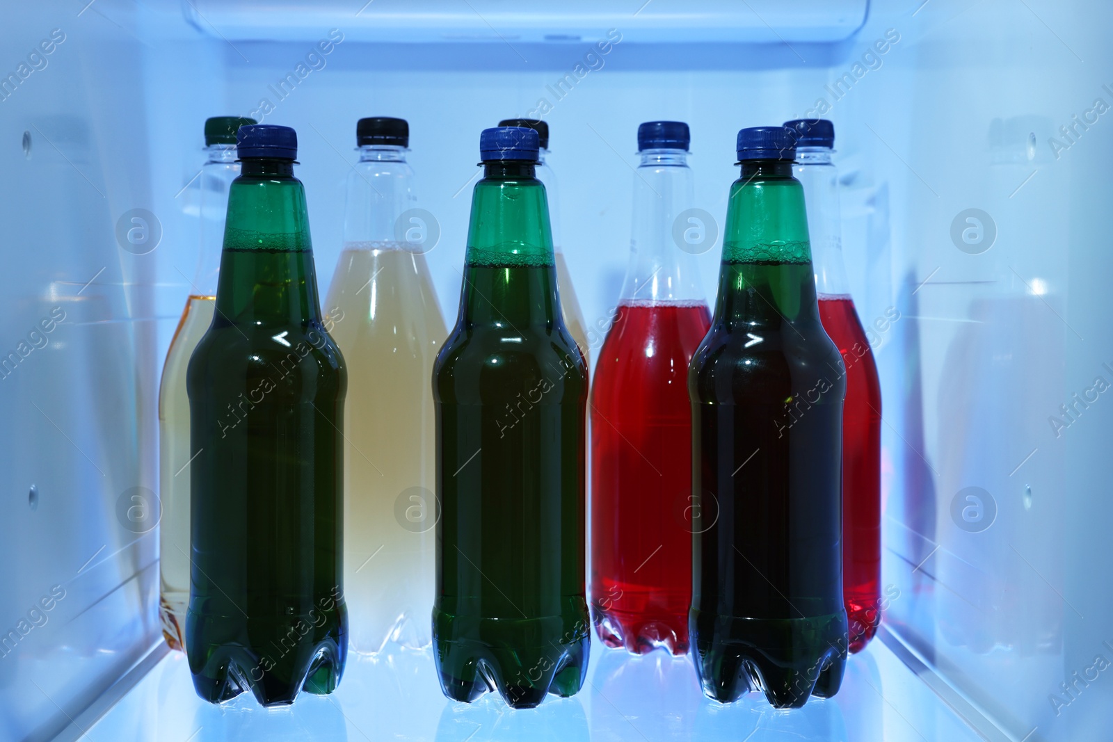 Photo of Many different cold drinks in refrigerator, closeup