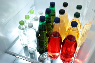 Many different cold drinks in refrigerator, closeup