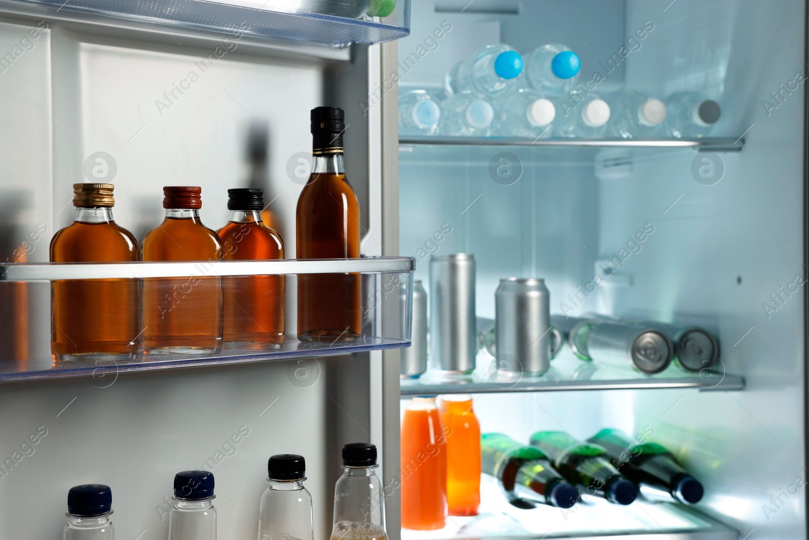 Photo of Many different cold drinks in refrigerator, closeup