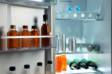 Photo of Many different cold drinks in refrigerator, closeup