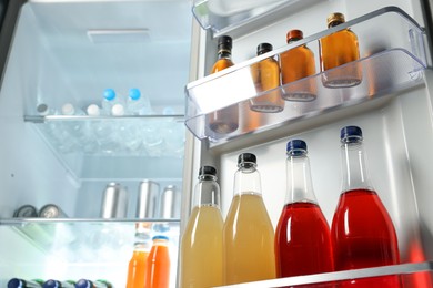 Many different cold drinks in refrigerator, low angle view