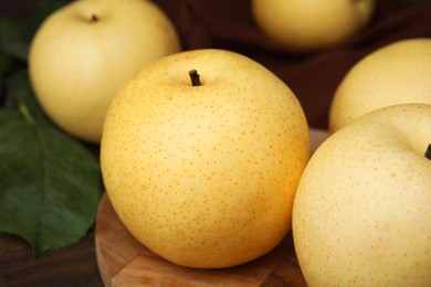 Photo of Delicious fresh apple pears on table, closeup