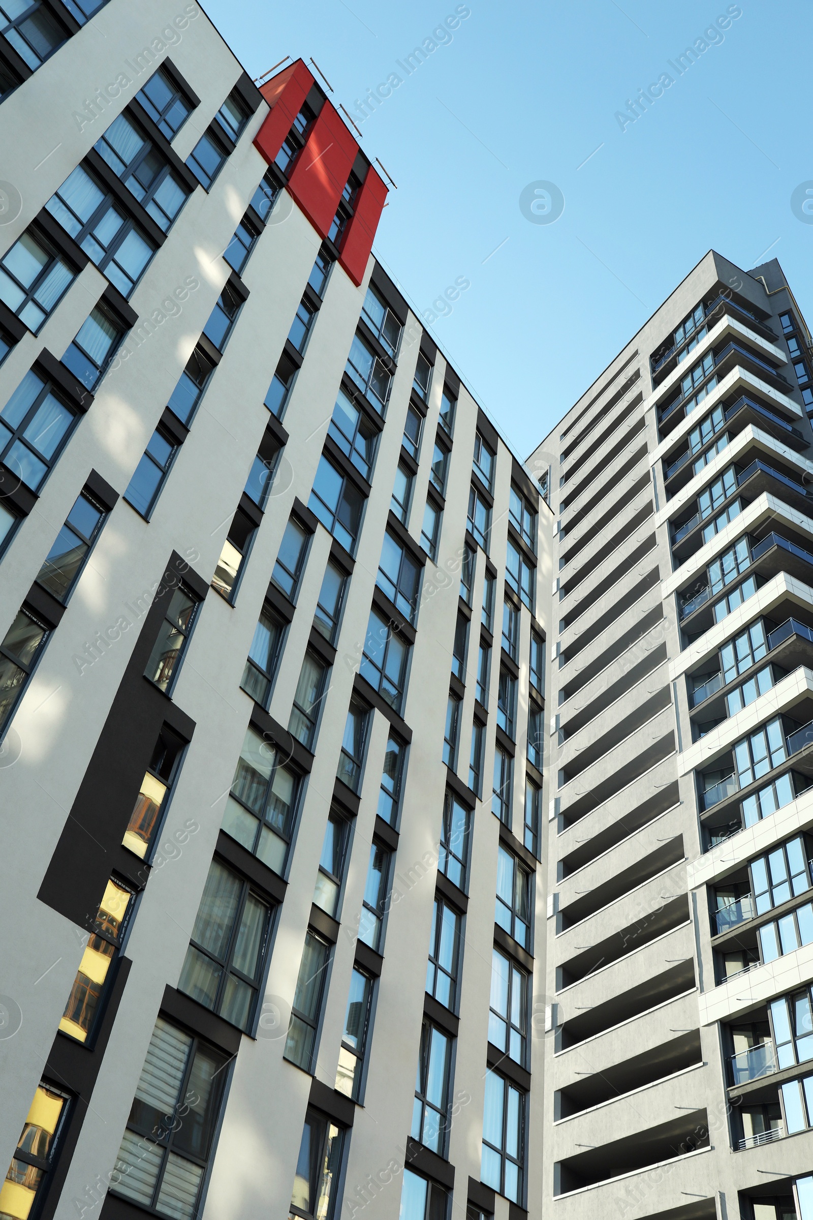 Photo of Exterior of modern building against blue sky, low angle view