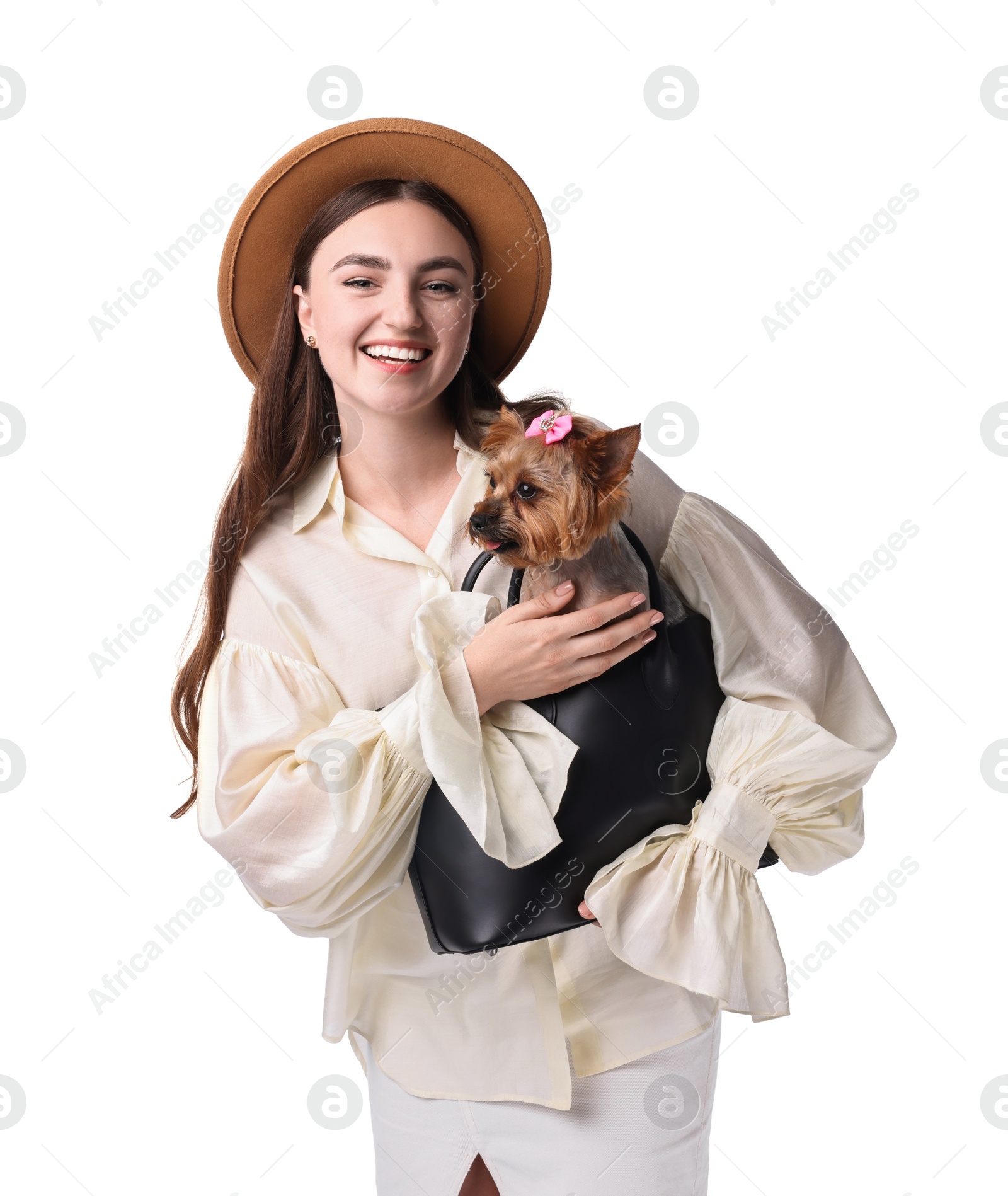 Photo of Beautiful young woman holding bag with cute Yorkshire Terrier dog isolated on white