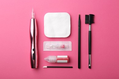 Permanent makeup equipment kit on pink background, flat lay