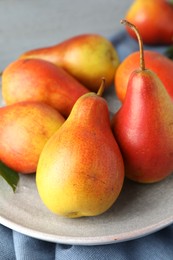 Photo of Many ripe juicy pears on table, closeup