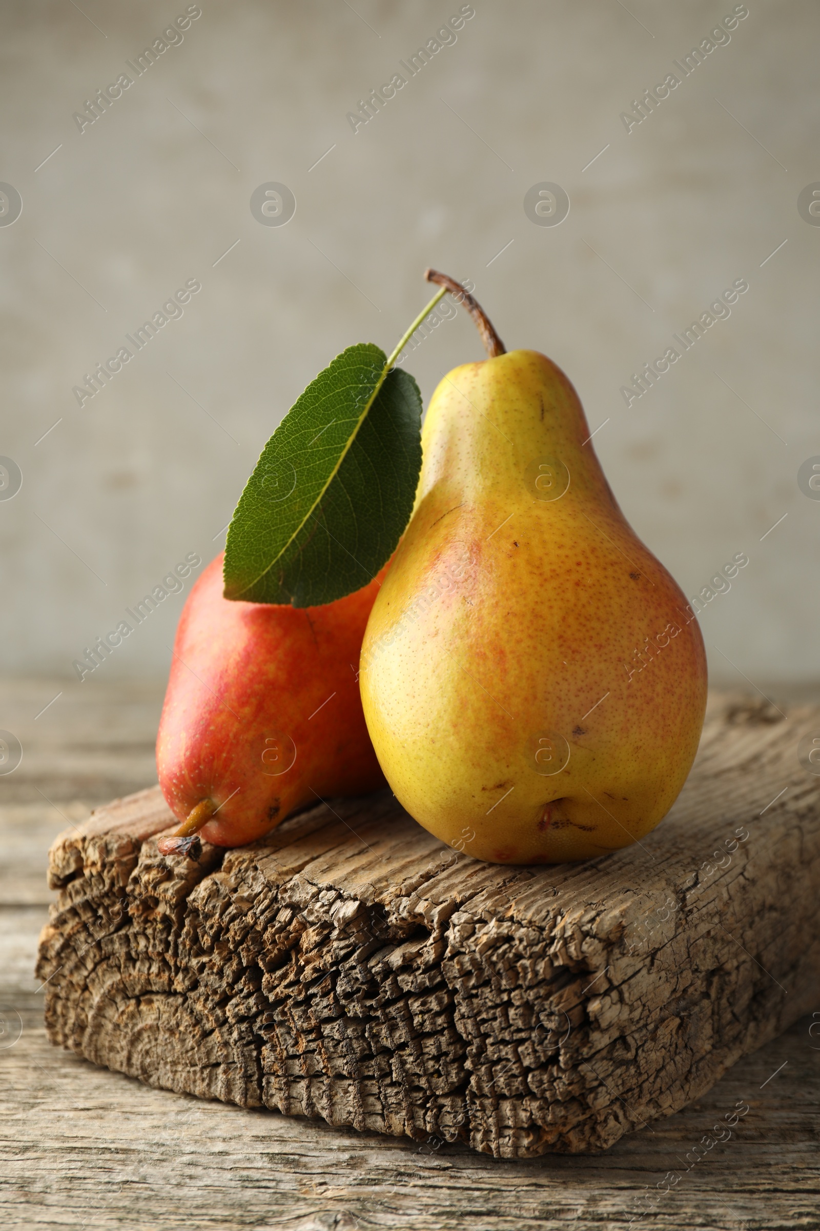 Photo of Two ripe juicy pears on wooden table