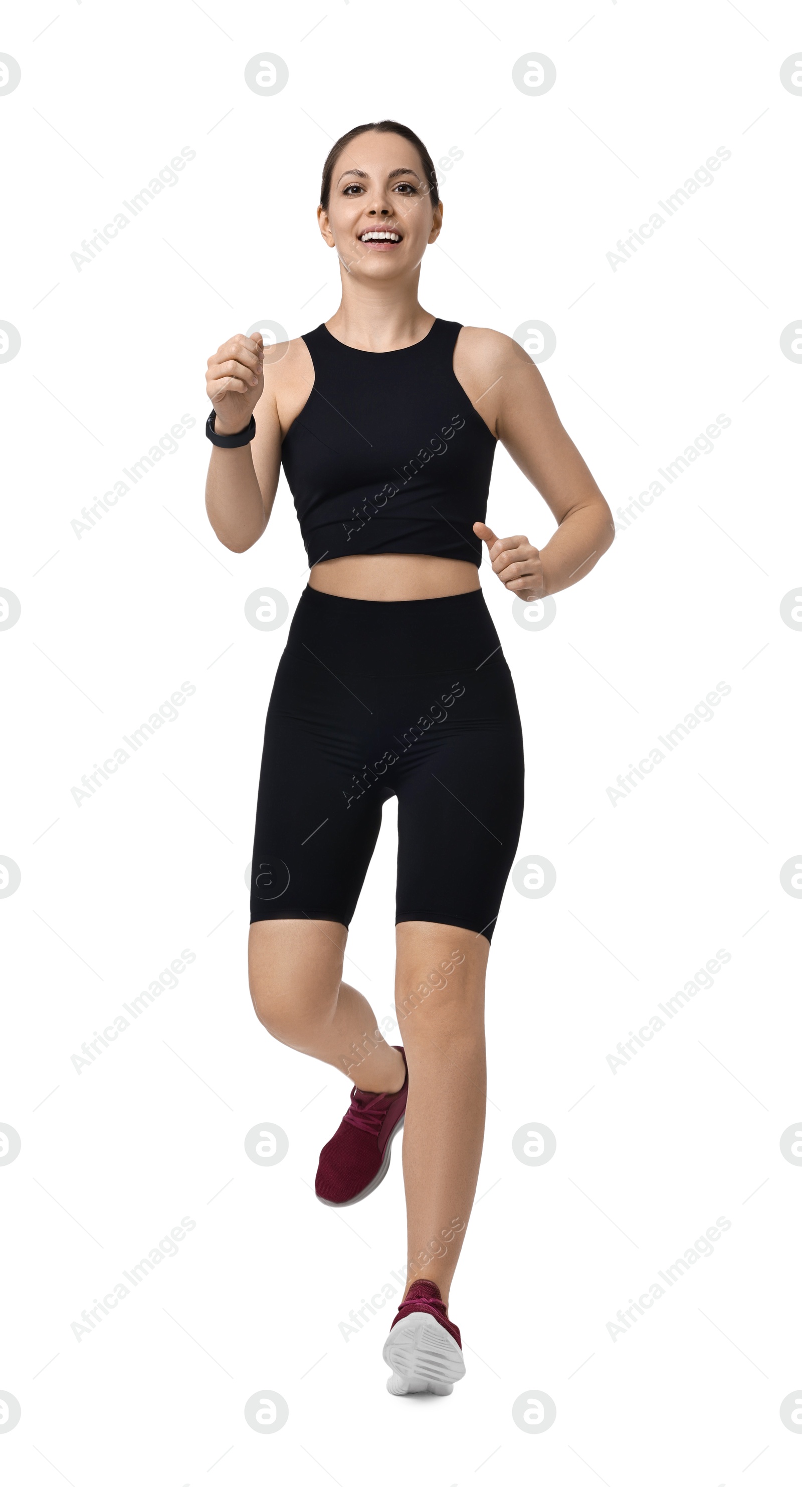 Photo of Smiling athletic woman running on white background