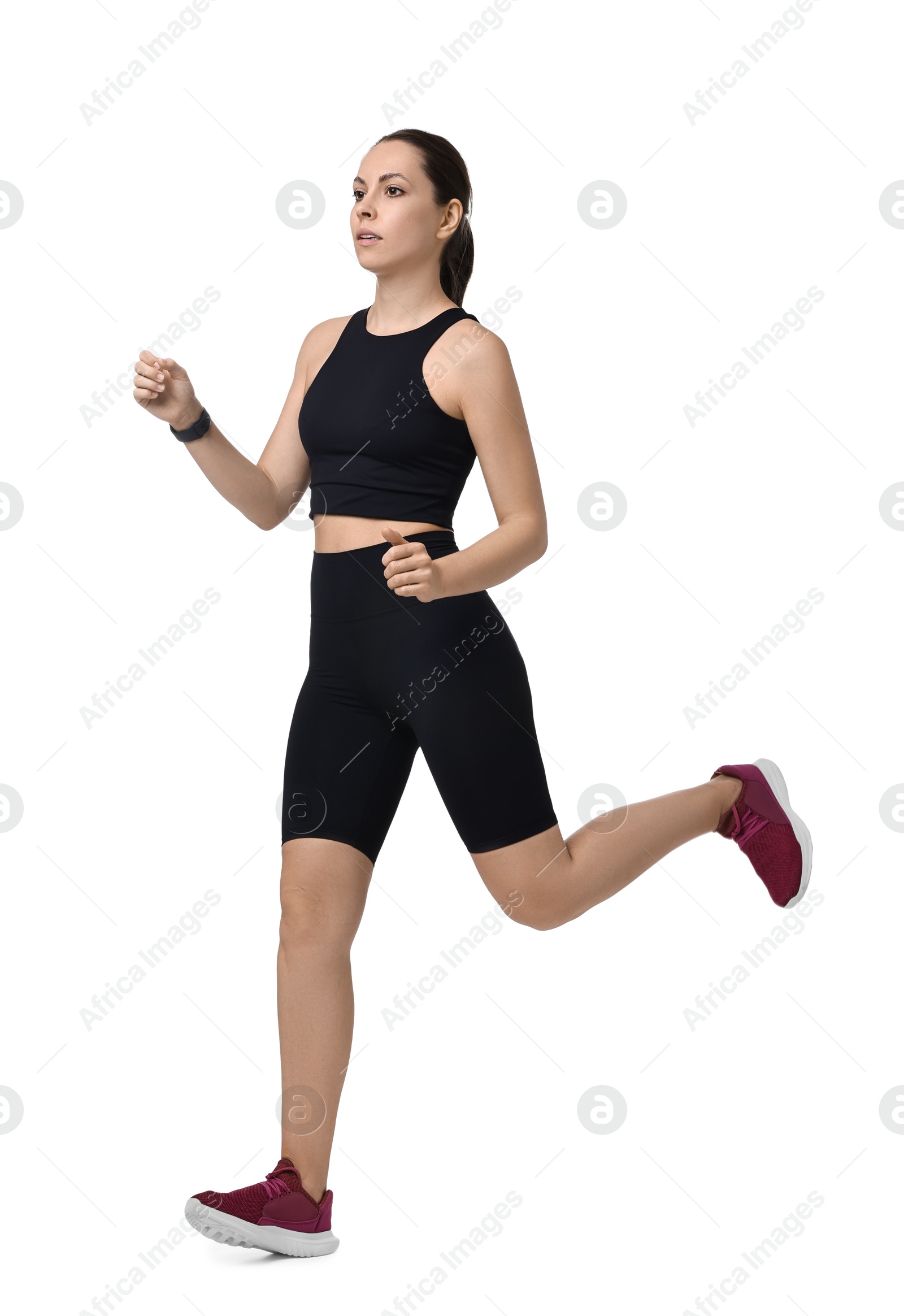 Photo of Athletic woman in sportswear running on white background