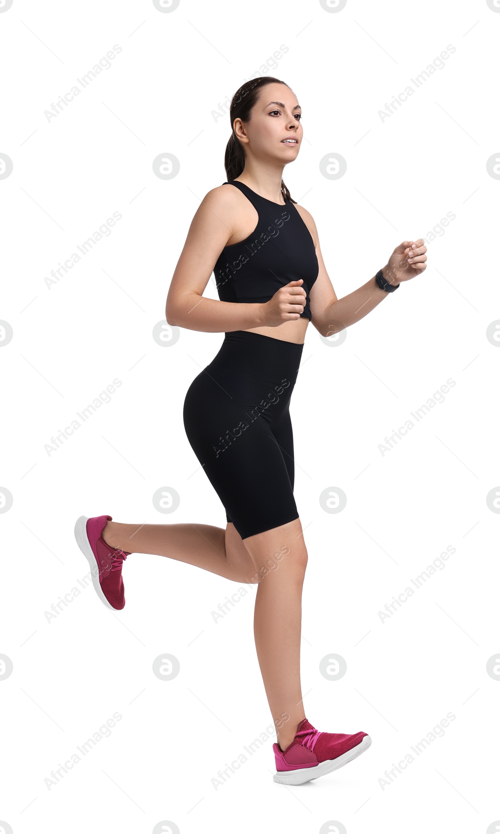 Photo of Athletic woman in sportswear running on white background