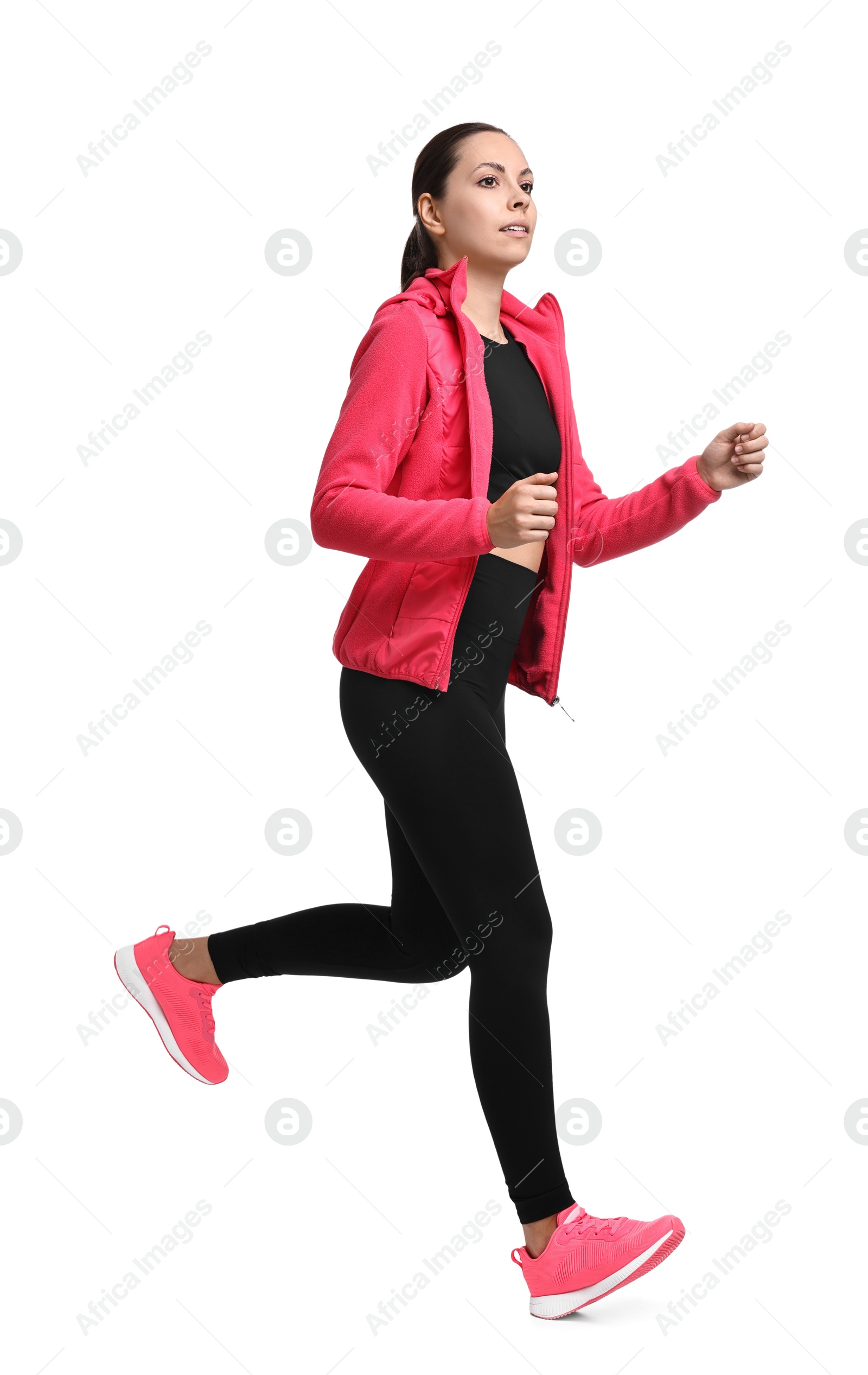 Photo of Athletic woman in sportswear running on white background